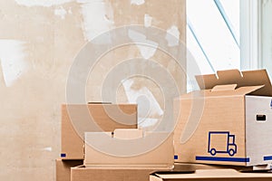 Heap of boxes in the interior of a residential room ready for renovation