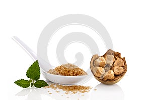 Heap of brown cane crystallized sugar and monk fruit