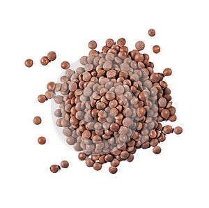Heap of brown lentils isolated