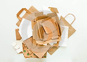 Heap of brown and white paper, prepared for recycling. Reduce, Reuse and Recycle concept. Flat lay