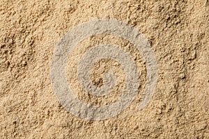 Heap of buckwheat flour as background, top view