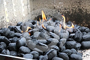 Burning charcoals in the grill