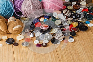 Heap of button on wood table
