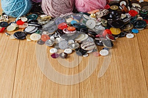 Heap of button on wood table