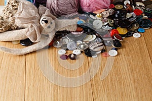 Heap of button on wood table