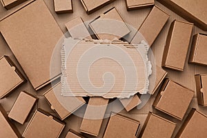 Heap of cardboard boxes from craft paper top view. Eco delivery, zero waste, plastic free package concept