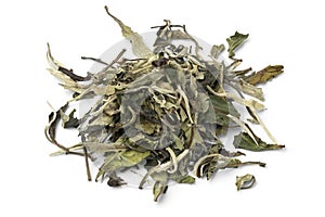 Heap of Chinese Pai Mu Tan tea close up on white background