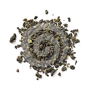 Heap of Chinese Ti Kuan Yin dried tea leaves close up on white background