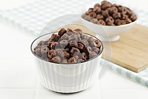 Heap of Chocolate Ring Cereal on White Bowl, Breakfast Concept