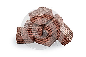 Heap of chocolate square brownie wafer biscuits isolated on white