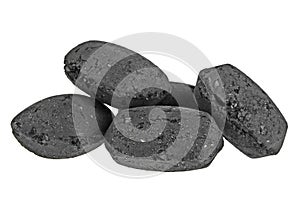 Heap of coal briquette for BBQ isolated on white background