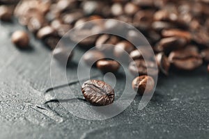 Heap of coffee beans on black background