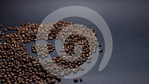 Heap of coffee beans on black background