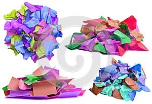 Heap of colored crumpled, used paper isolated on white background