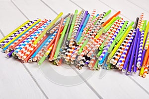 Heap of colorful paper straws for party cocktails photo