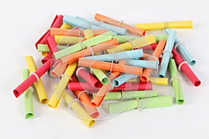 Heap of colorful tombola tickets are lying in the white studio