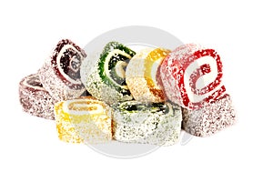 Heap of colorful Turkish delight isolated on white background. Turkish sweets isolated on white background. Ramadan.