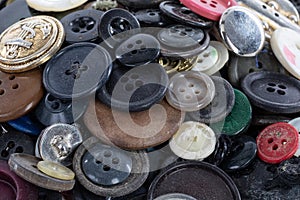 Heap of coloured and antique buttons