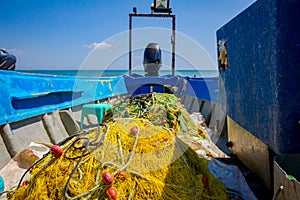 Heap of commercial fishing net on ship`s deck