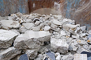 Heap of crack concrete and tile debris of demolition waste from destruction of buildings