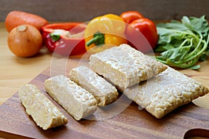 Heap of Cut Fresh Tempeh for Cooking Whole Foods Plant-based Dishes photo