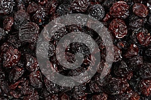 Heap of dark blue raisins. Background. Closeup. View from above