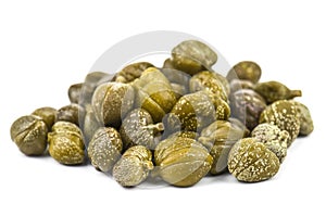 Heap of delicious capers on white background