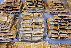 Heap of delicoius strudel stuffed with poppy apfel and cherry photo