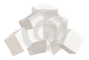 Heap of diced soft cheese isolated on white background. Feta