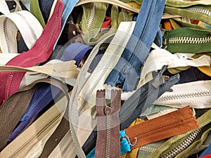 A heap of different coloured zips and zippers