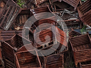 Heap of discarded rusty metal storage boxes