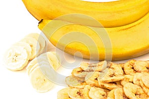 Heap of dried banana chips with banana cluster