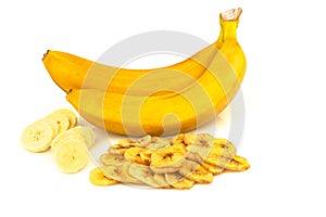 Heap of dried banana chips with banana cluster