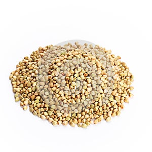 Heap of dried buckwheat seeds isolated on white background