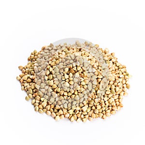 Heap of dried buckwheat seeds isolated on white background