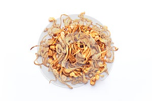 heap of dried cordyceps militaris mushroom