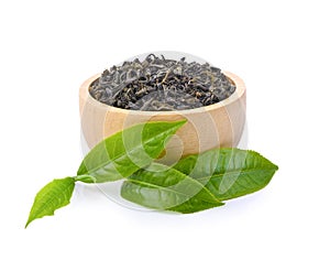 Heap of dried green tea leaf on white background