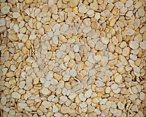 Heap of dried peeled fava beans. Food background and texture