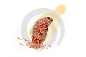 Heap of dried saffron spice isolated on white background