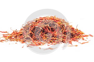 Heap of dried saffron spice isolated on white background