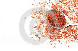 Heap of dried saffron spice isolated on white background