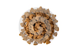 Heap of Dry dog food pellets isolated on white background.