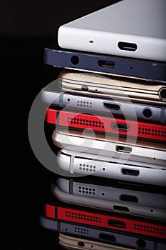 Heap of electronical devices close up - smartphones