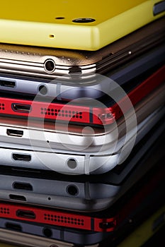 Heap of electronical devices close up - smartphones