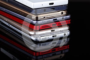 Heap of electronical devices close up - smartphones