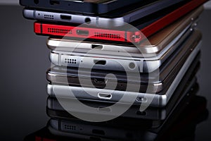 Heap of electronical devices close up - smartphones