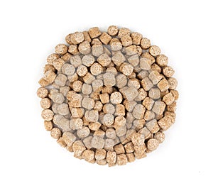 Heap extruded granules of wheat bran isolated on a white background top view