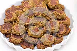 Heap of falafels in large white bowl