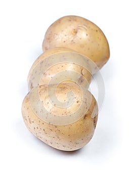 Heap of flawed natural potatoes photo