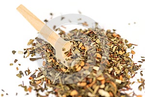 Heap of floral loose leaf herbal tea blend isolated on a white